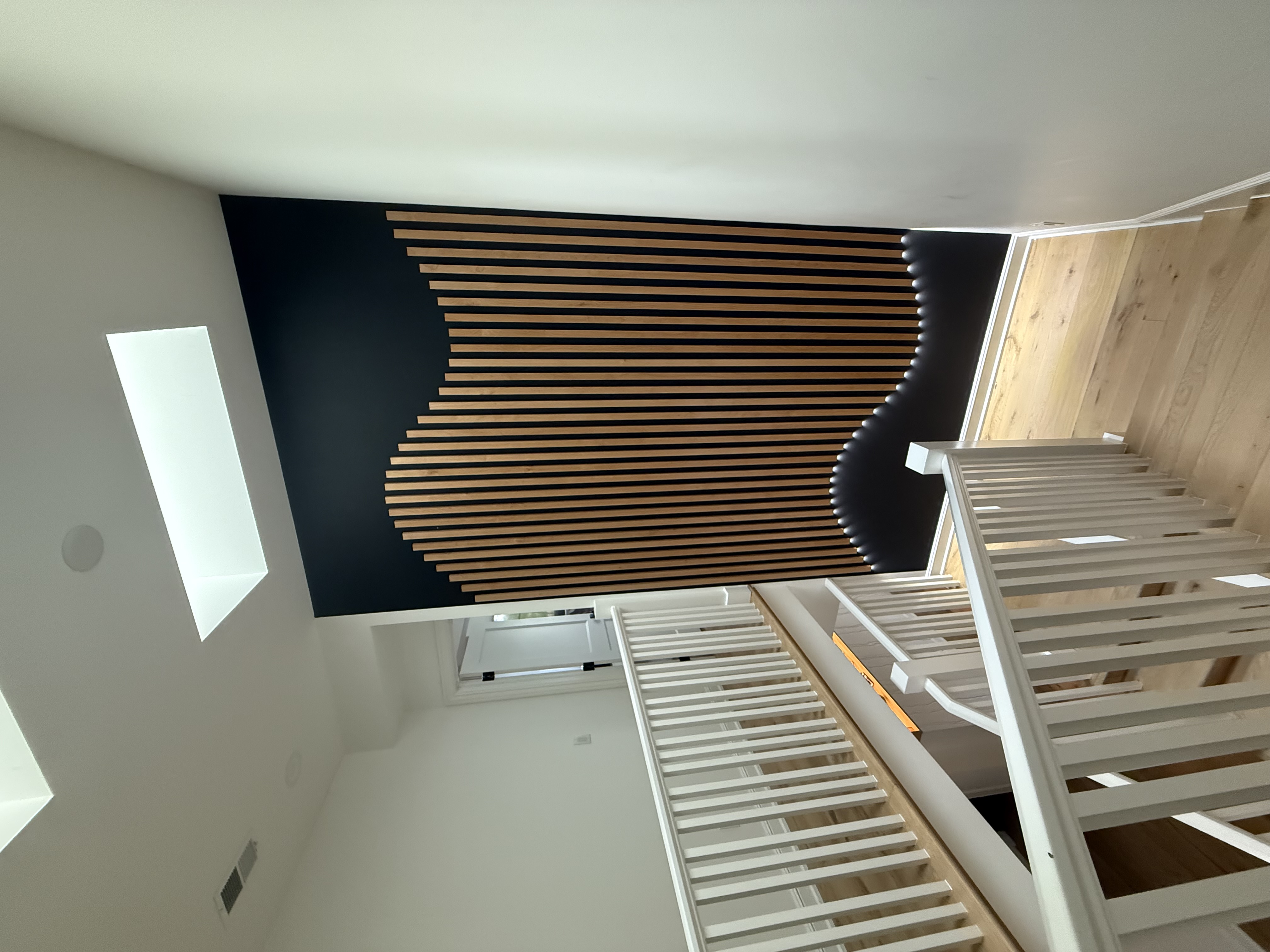 Custom built-in media wall with floating shelves Denver by Blue Sky Renovations