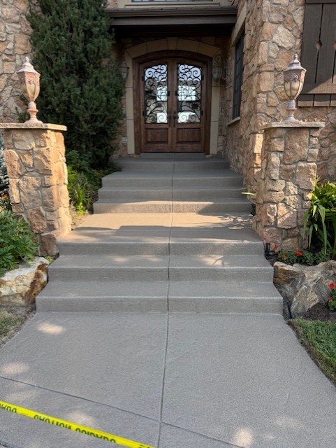 Restored and resealed stamped concrete entry steps